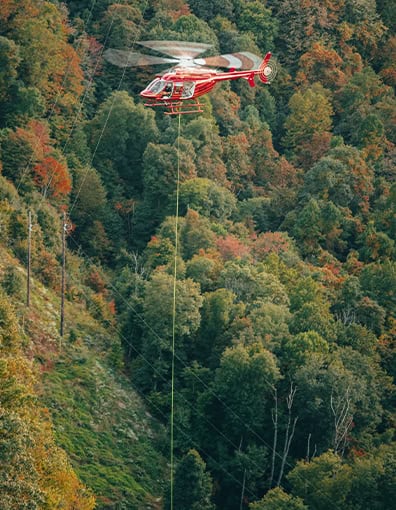Red Helicopter Transmission Line Stringing Powerline Construction