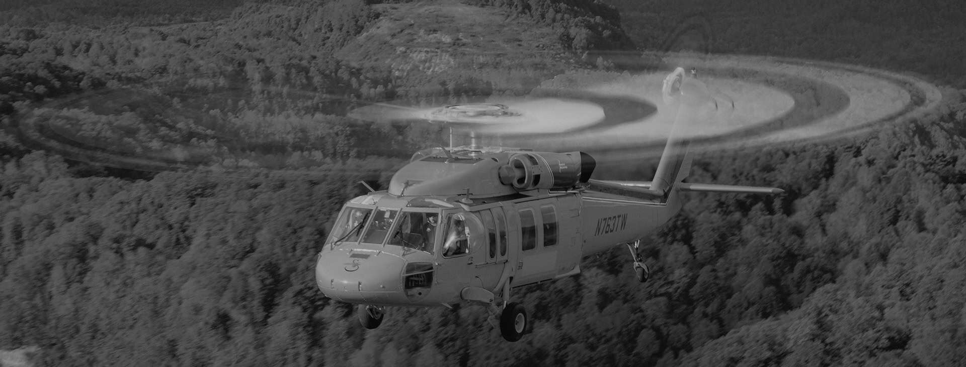 Helicopter Flying Over Forest