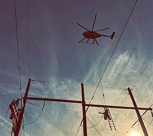 Helicopter Flying Power Line Maintenance