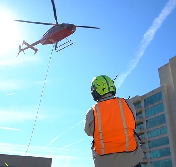 Helicopter Lift Crew Guiding External Load