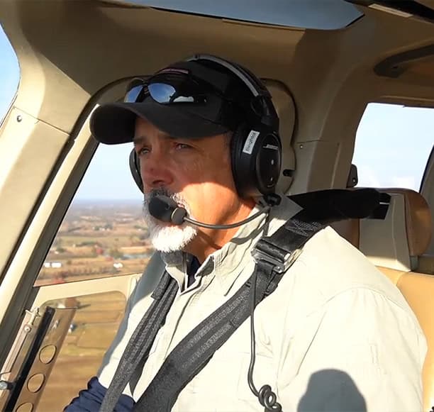 Helicopter Pilot In Flight Cockpit