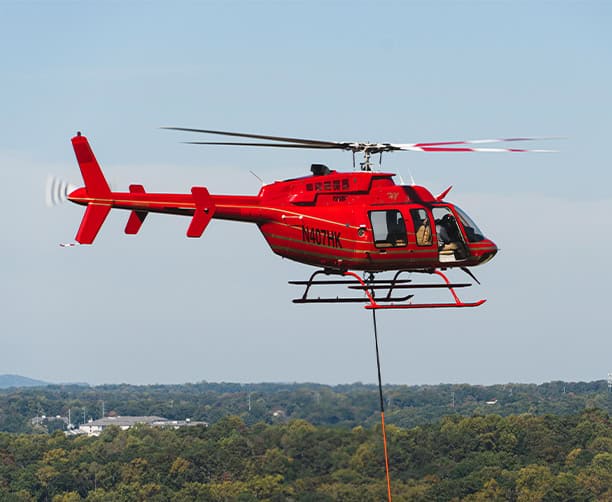 Red Helicopter Aerial Lift Operation