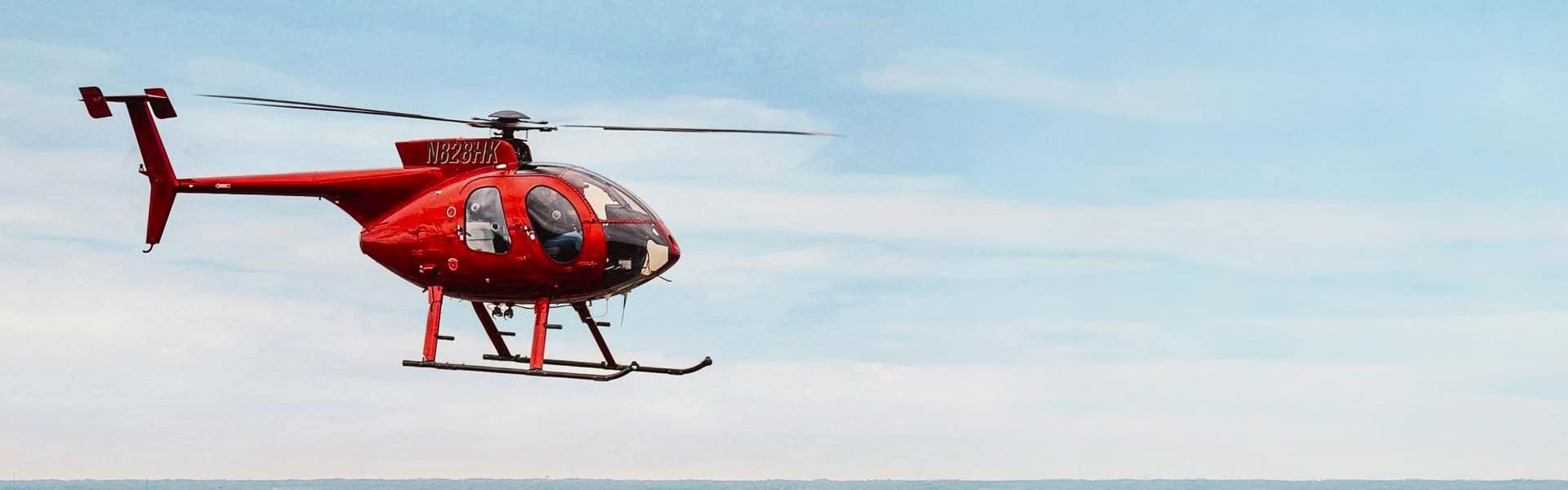 Red Helicopter In Flight Open Sky